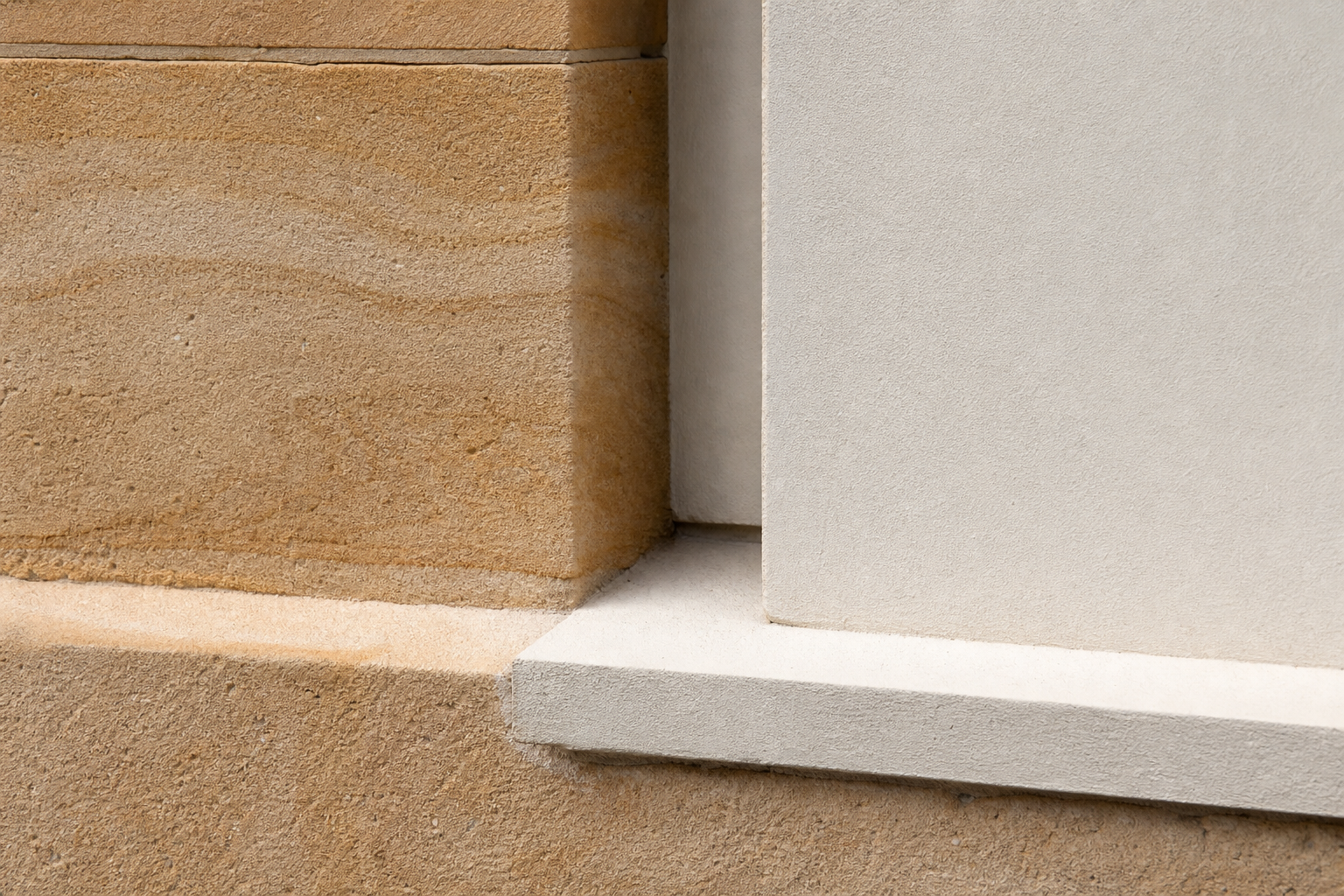 Close-up of warm stone and render
